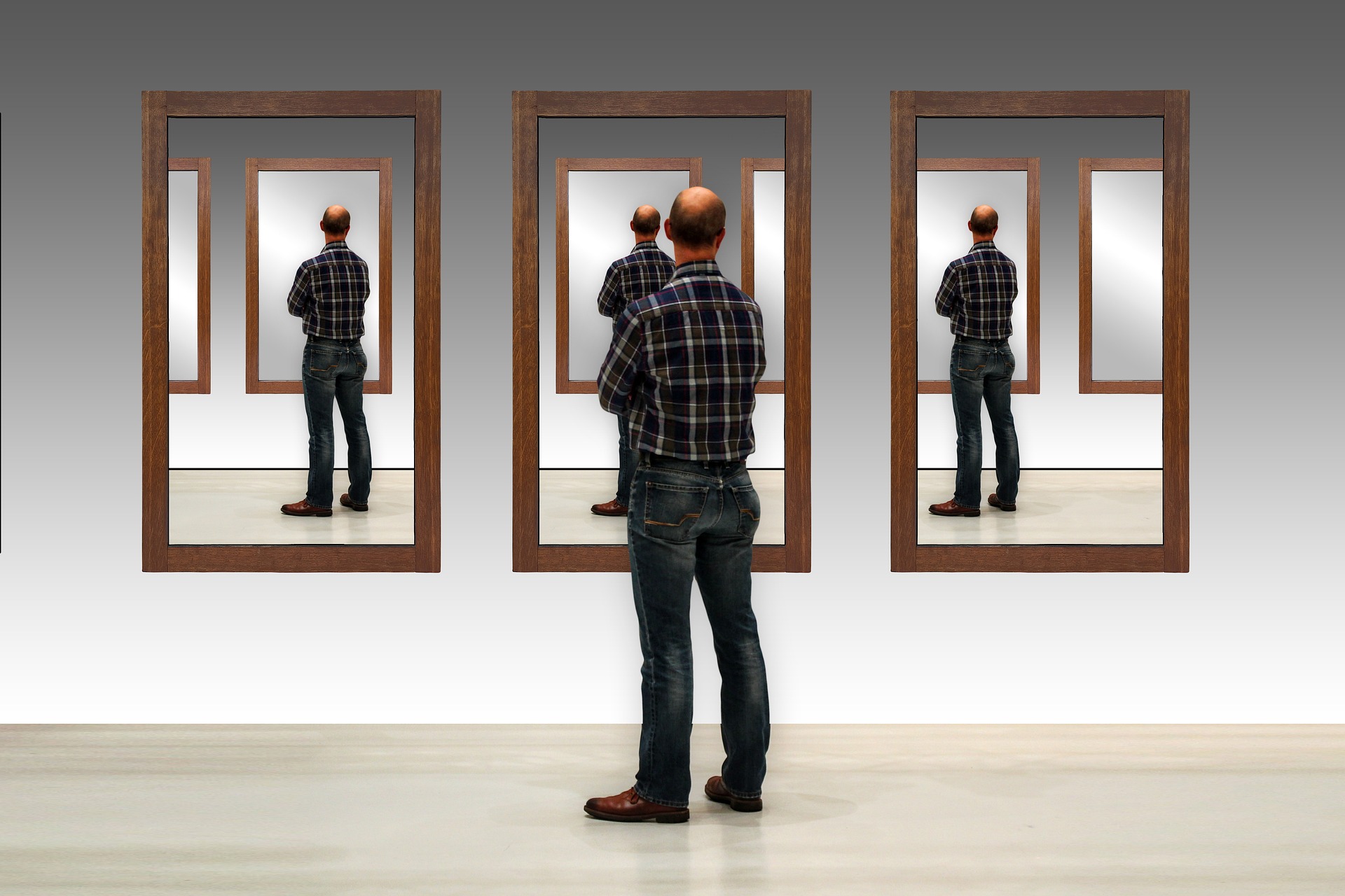 Man standing in front of mirrors